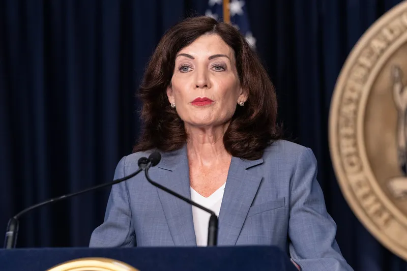 Governor Kathy Hochul stands at a podium.