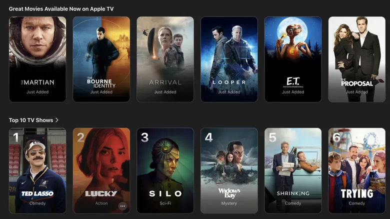 Apple TV content grid showing news movies like The Marian, Arrival and E.T.