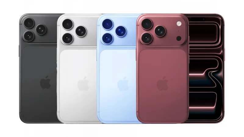 Four modern iPhones standing upright in a row, showing backs in black, white, light blue, and pink with dual cameras, plus one front view displaying a dark abstract wallpaper