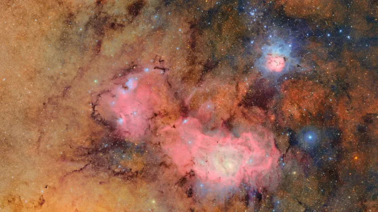 A composite image captured by the observatory showing clouds of gas and dust of the Trifid Nebula (top) and the Lagoon Nebula