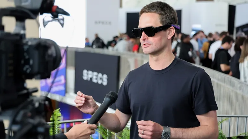Evan Spiegel, co-founder and CEO of Snap, being interviewed while wearing Specs glasses.