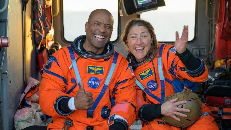 Artemis II astronauts Victor Glover and Christina Kock beaming after their splashdown