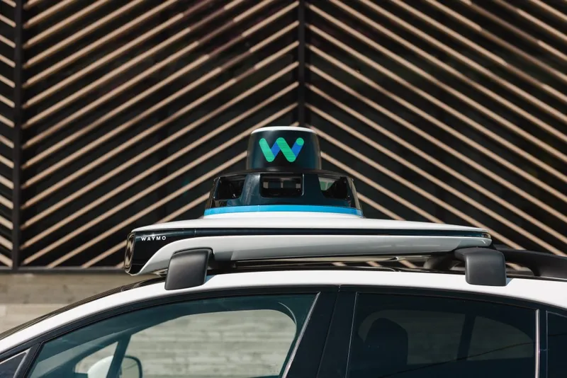 top of Waymo car, showing equipment on roof