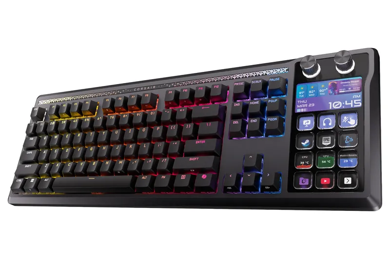 An image of the full Corsair Galleon 100 SD wired mechanical gaming keyboard. On its left side is a keyboard, and where the numpad would normally go there’s a full Stream Deck with 12 buttons, a 5-inch screen, and two rotary dials. The keyboard’s RGB backlights show a gradient from yellow to red.