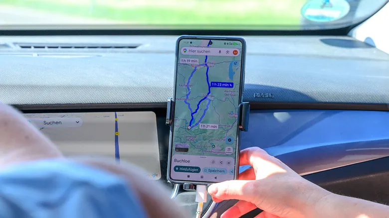 Google Maps being used on a phone during a car journey in Germany
